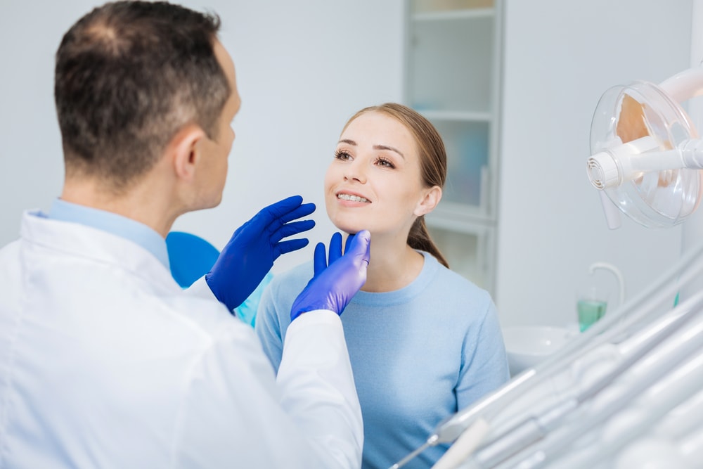 woman during a dental visit after post bone grafting